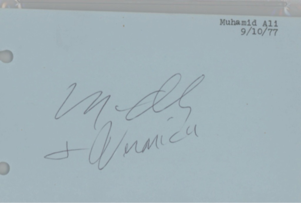 Muhammad Ali (signed with his then-wife Veronica Porché Ali)