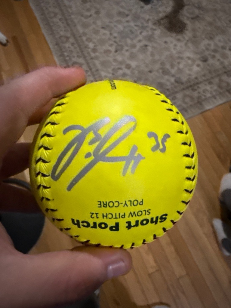 Unknown (Inconclusive, potentially a softball player or local sports figure)