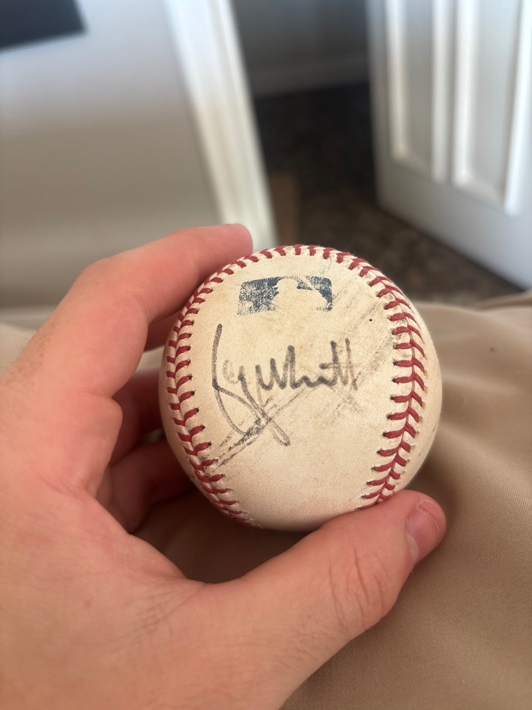 Royals player (likely a specific player from the Kansas City Royals, such as Whit Merrifield given the signature resembling 'Whit', though confirmation is required)